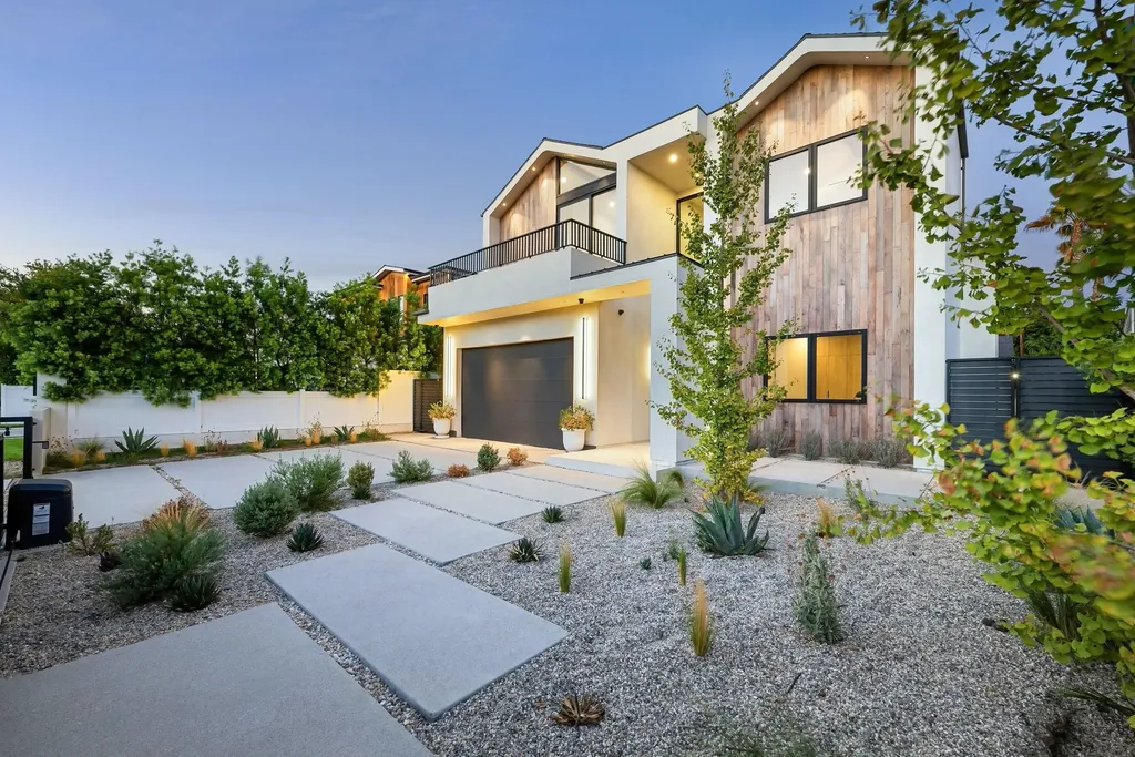 Exterior view of a modern home at dusk, with Bundaberg Conveyancing